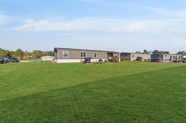a house view with a garden space