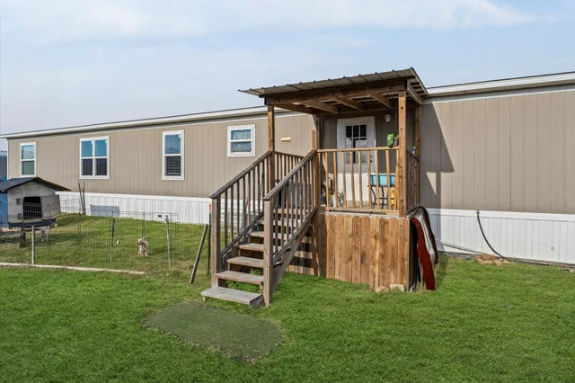 a front view of house with yard and seating area