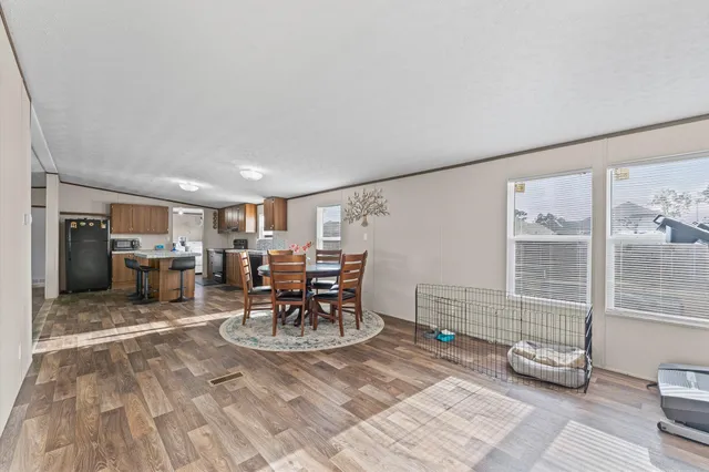 a room with lots of furniture and a table