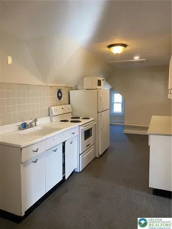 a view of cabinets and window