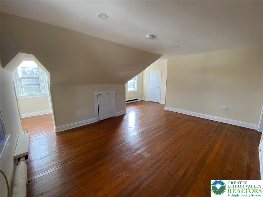 3629 Dorney Road, Unit 3A Allentown, PA 18104 - Photo 5 of 8 an empty room with wooden floor and windows
