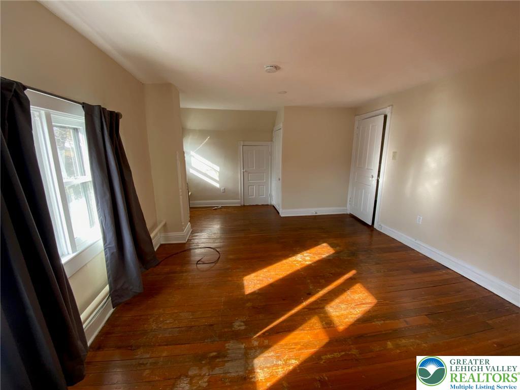 3629 Dorney Road, Unit 3A Allentown, PA 18104 - Photo 7 of 8 a view of empty room with wooden floor