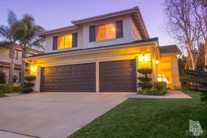 2480 Rutland Place Thousand Oaks, CA 91362 - Photo 1 of 23 a view of yellow house with a small yard and a large parking space