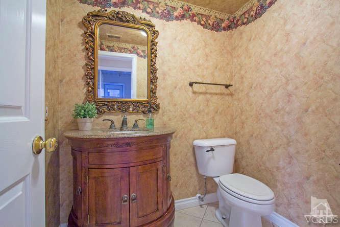 2480 Rutland Place Thousand Oaks, CA 91362 - Photo 15 of 23 a bathroom with a granite countertop toilet sink and mirror
