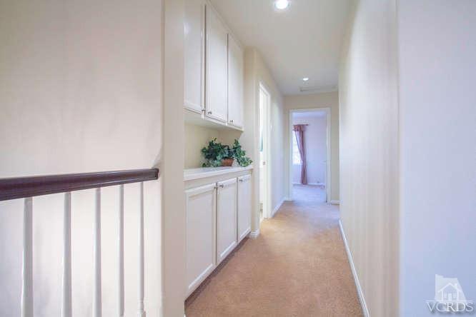 2480 Rutland Place Thousand Oaks, CA 91362 - Photo 16 of 23 a view of a hallway with white cabinets