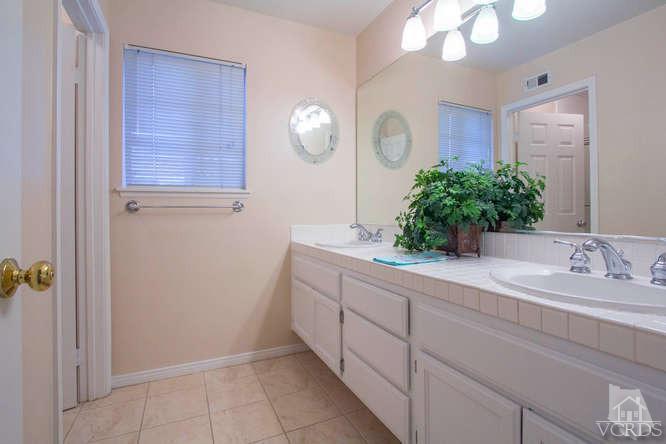 2480 Rutland Place Thousand Oaks, CA 91362 - Photo 17 of 23 a spacious bathroom with a granite countertop sink a mirror and a vanity