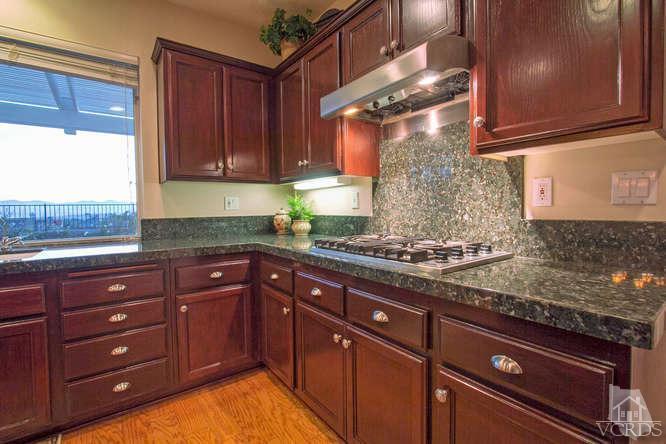 2480 Rutland Place Thousand Oaks, CA 91362 - Photo 3 of 23 a kitchen with stainless steel appliances granite countertop a stove and a sink