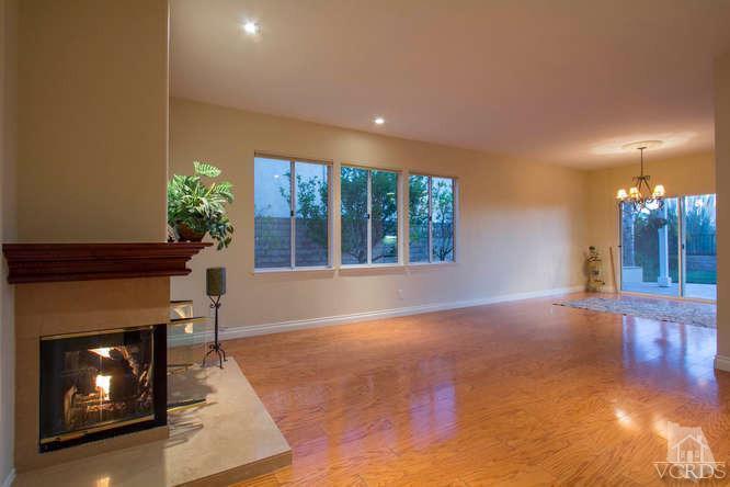 2480 Rutland Place Thousand Oaks, CA 91362 - Photo 7 of 23 a view of an empty room with a fireplace and window