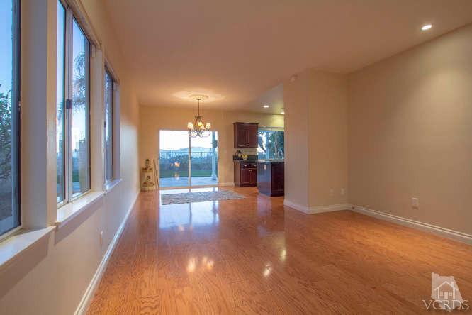 2480 Rutland Place Thousand Oaks, CA 91362 - Photo 8 of 23 a view of a hallway with wooden floor and a living room