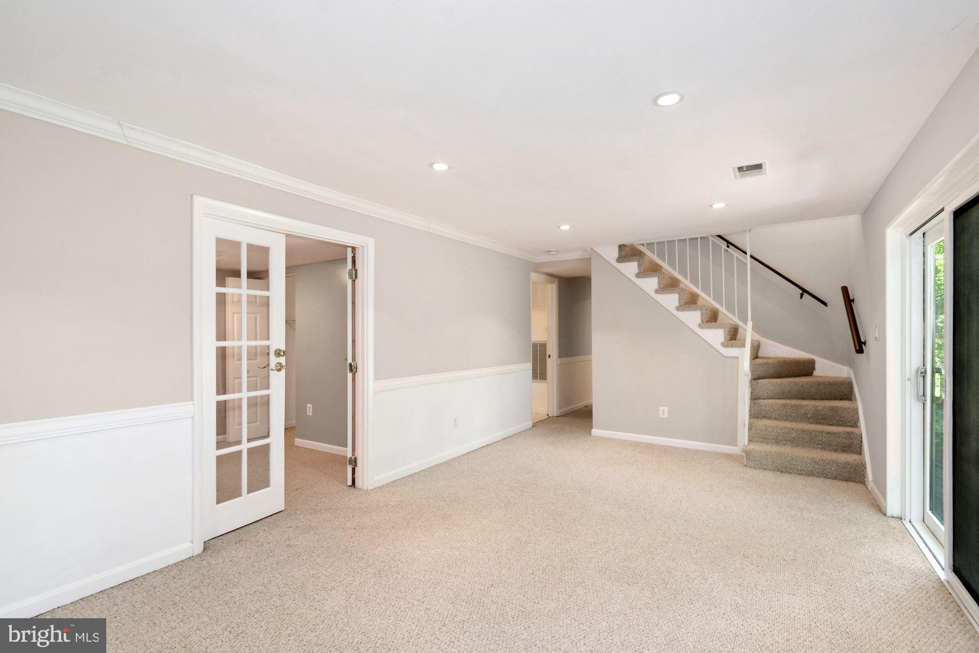 7922 East Rockglen Court Springfield, VA 22152 - Photo 22 of 38 Basement Rec Room With Free Standing Gas Fireplace