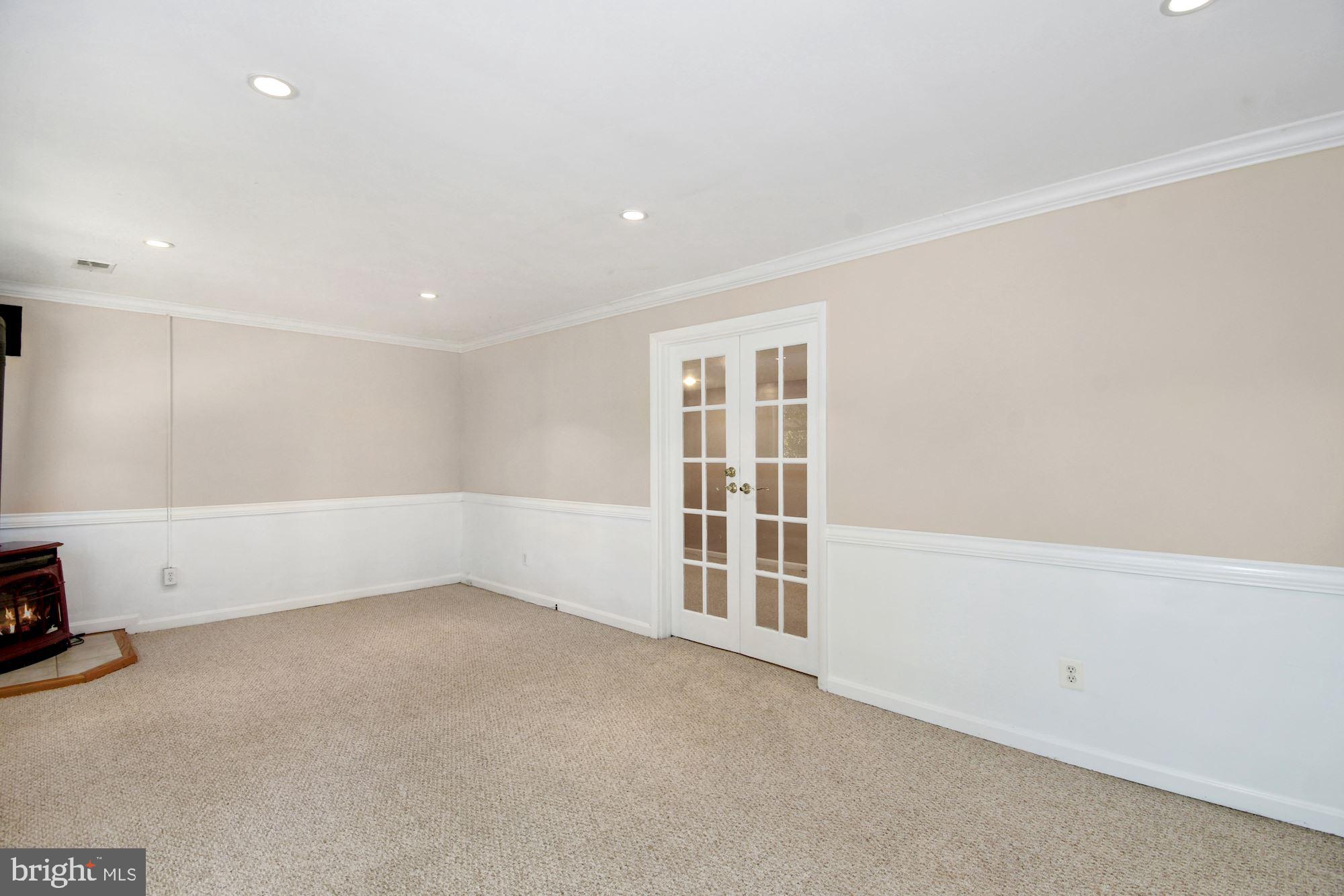 7922 East Rockglen Court Springfield, VA 22152 - Photo 24 of 38 Basement Rec Room With Free Standing Gas Fireplace