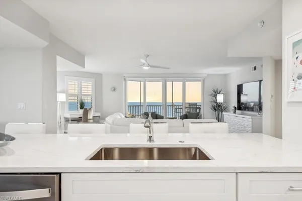 a kitchen with granite countertop a sink and a counter top space