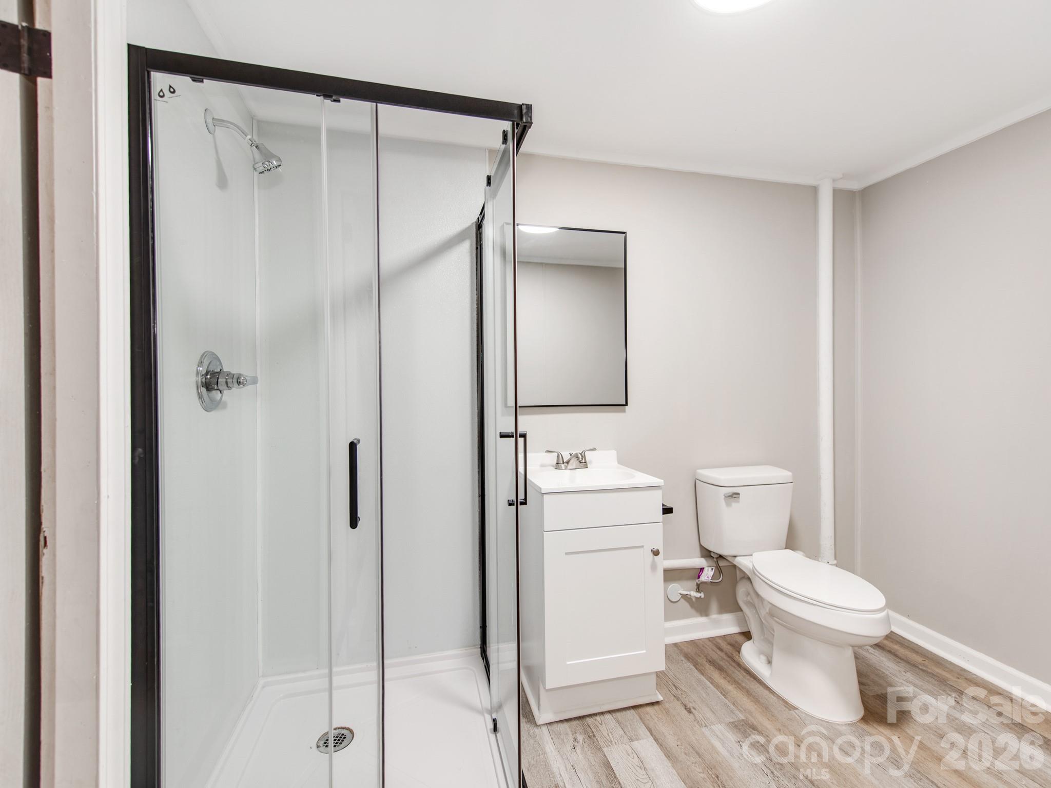 113 Falls Street Morganton, NC 28655 - Photo 27 of 33 a white toilet sitting next to a bathroom sink