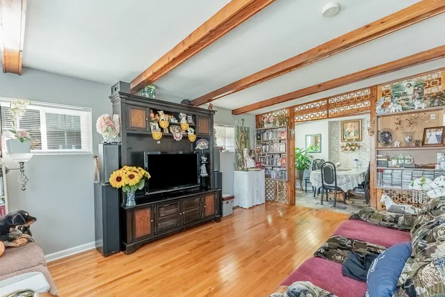 a living room filled with furniture and a flat screen tv