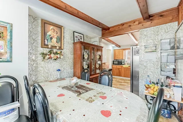 a bedroom with a bed a table and chair