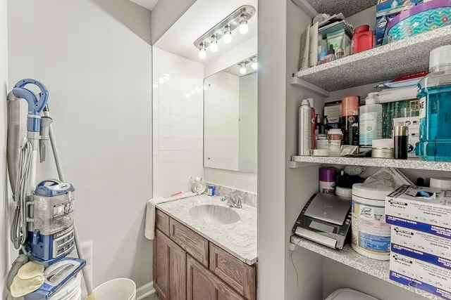 a bathroom with a sink double vanity and a mirror