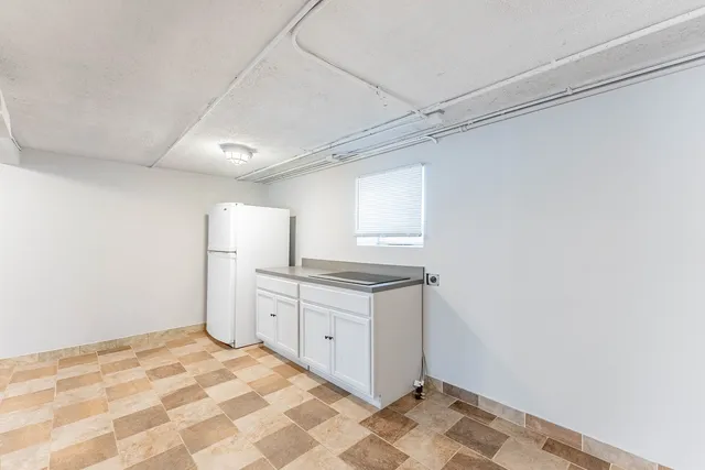 a bathroom with a sink a mirror and a shower