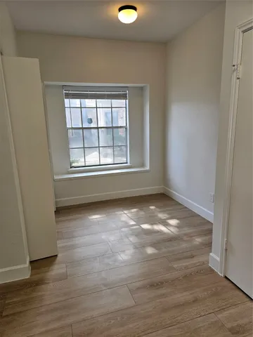 wooden floor and window in a room