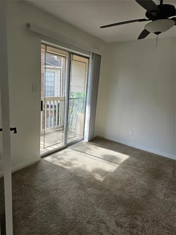 a view of empty room with floor to ceiling window