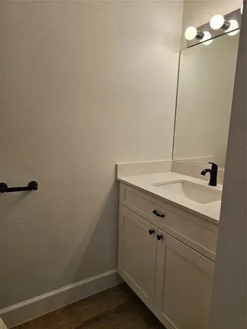a bathroom with a sink and mirror
