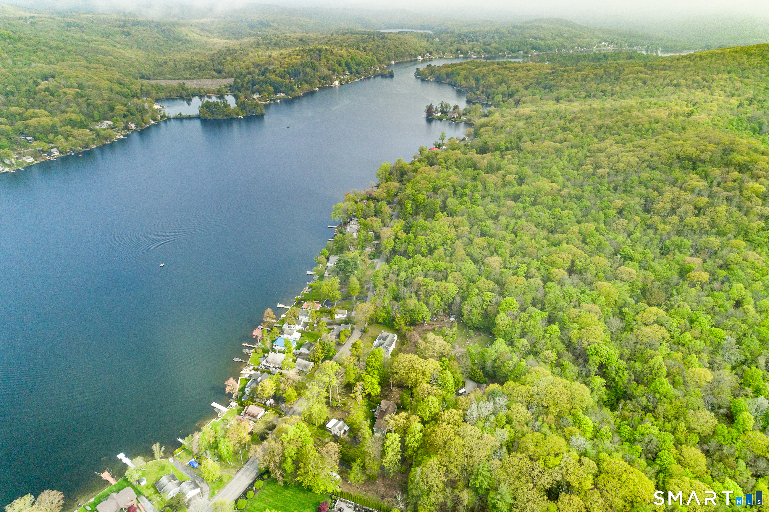 624 Wynne Road Winchester, CT 06098 - Photo 9 of 22 a view of a lake with a city