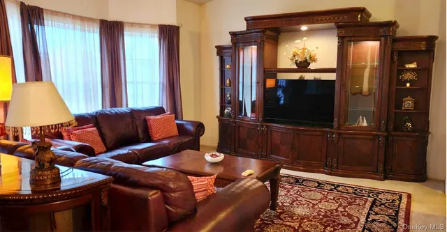 a balcony with a table and chairs