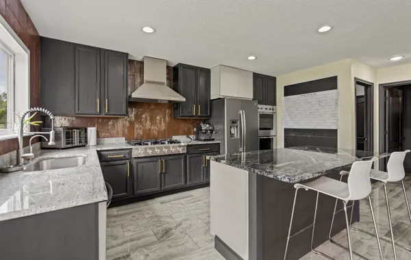 a bedroom with a bed window and couch