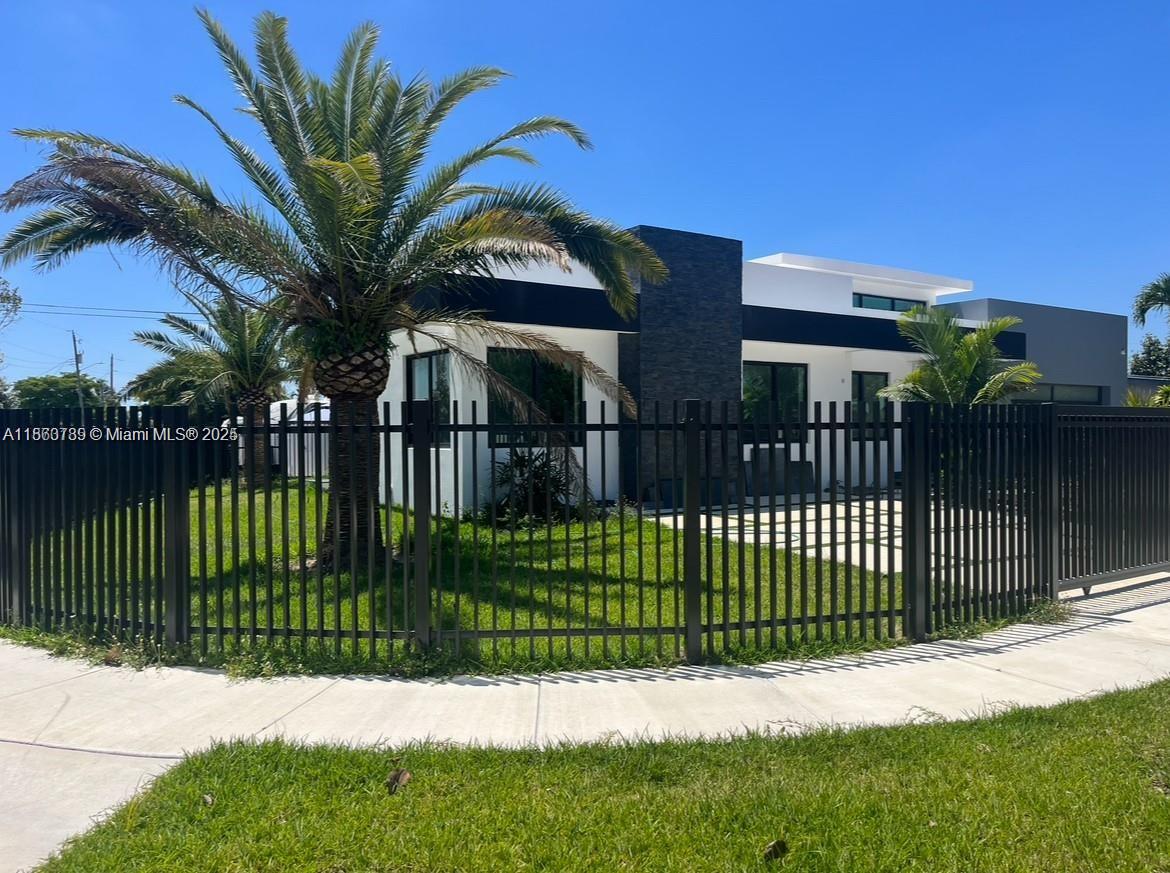 10960 Southwest 42nd Terrace Miami, FL 33165 - Photo 1 of 38 a view of a house with a fence