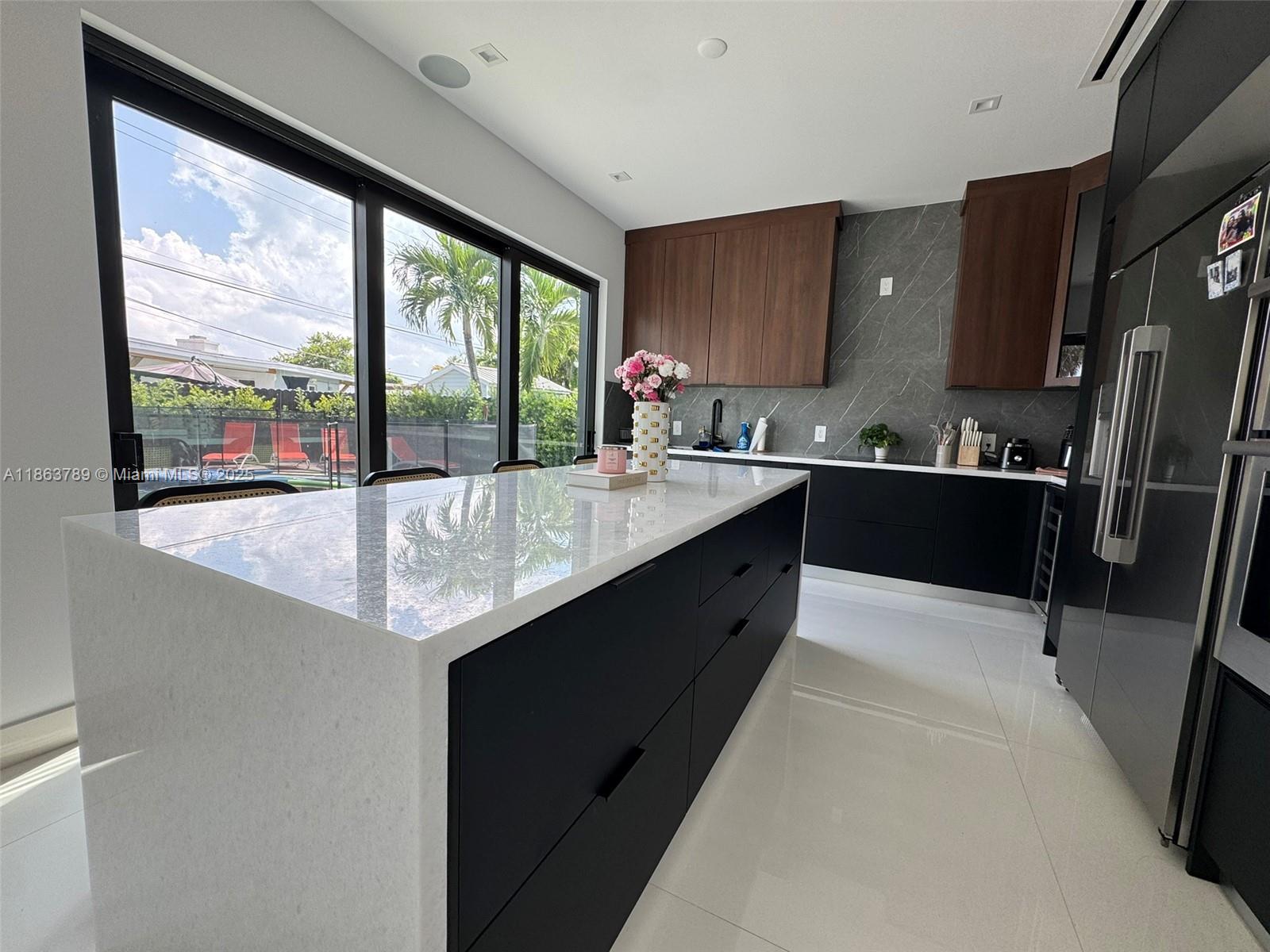 10960 Southwest 42nd Terrace Miami, FL 33165 - Photo 20 of 38 a kitchen with a sink a counter top space and stainless steel appliances