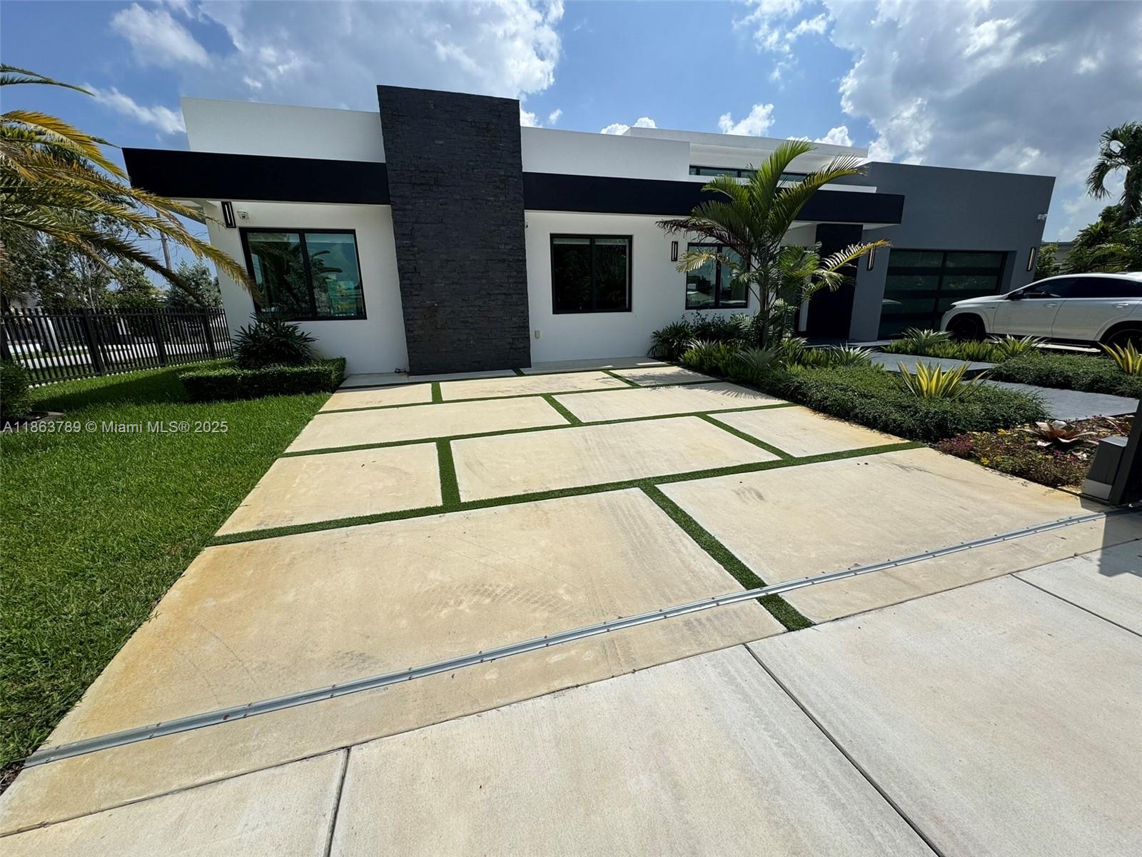 10960 Southwest 42nd Terrace Miami, FL 33165 - Photo 2 of 38 a front view of house with yard