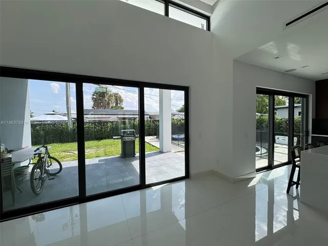 a view of a living room and floor to ceiling window