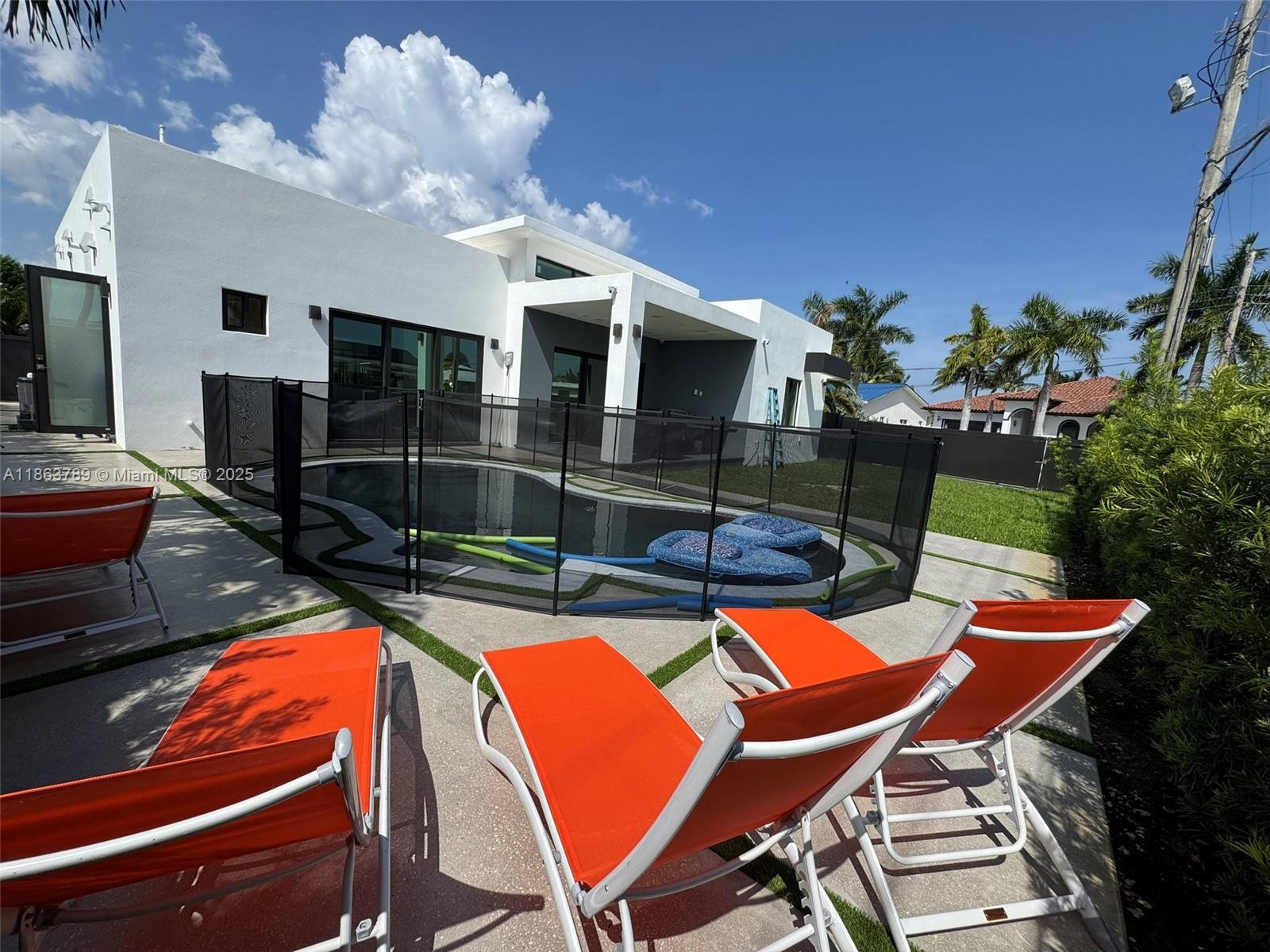 10960 Southwest 42nd Terrace Miami, FL 33165 - Photo 37 of 38 a view of a chairs and table in the patio