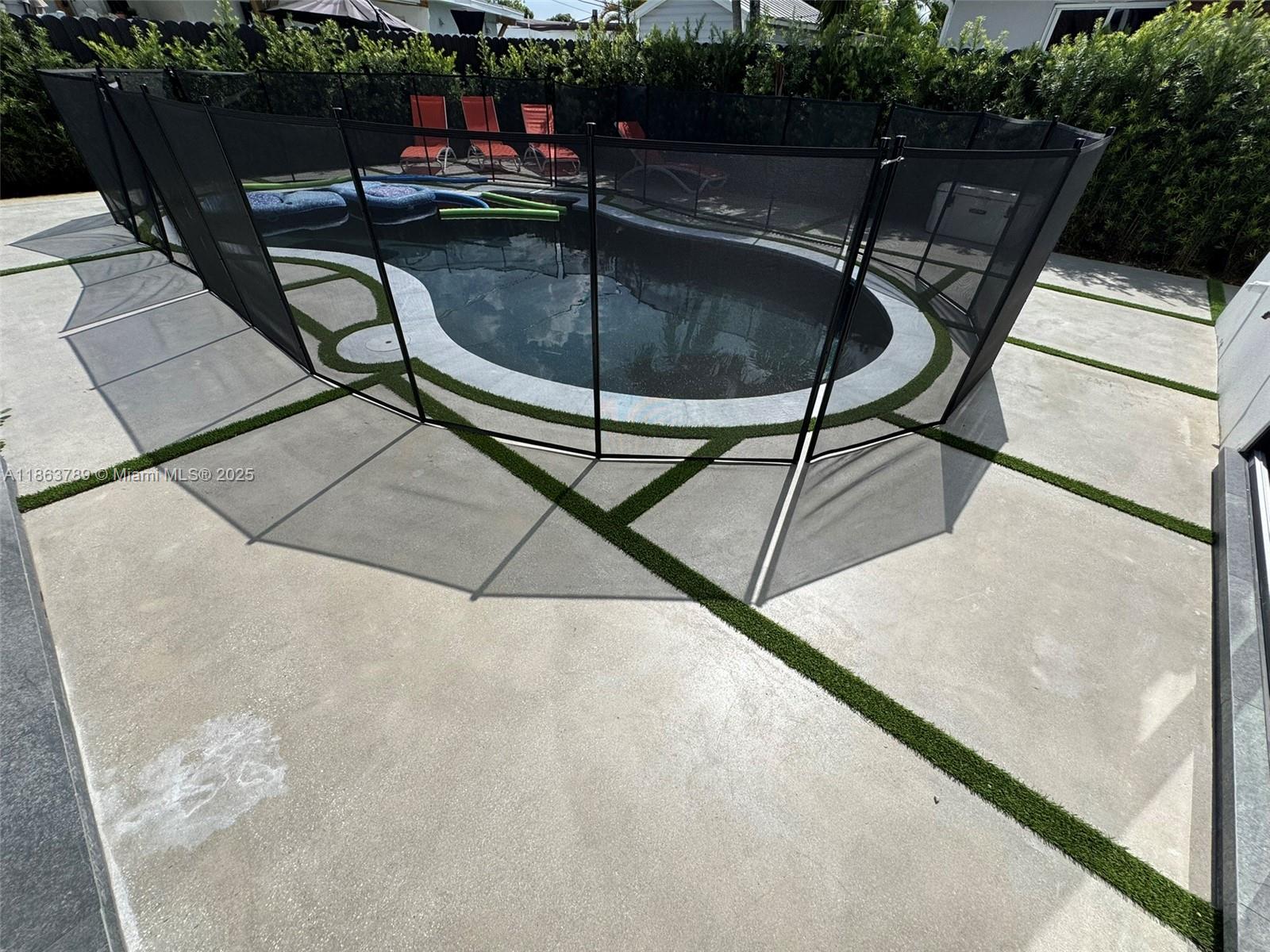 10960 Southwest 42nd Terrace Miami, FL 33165 - Photo 38 of 38 a view of swimming pool with chairs