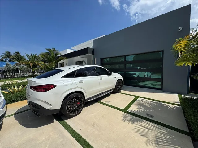 a view of a car parked in the parking area