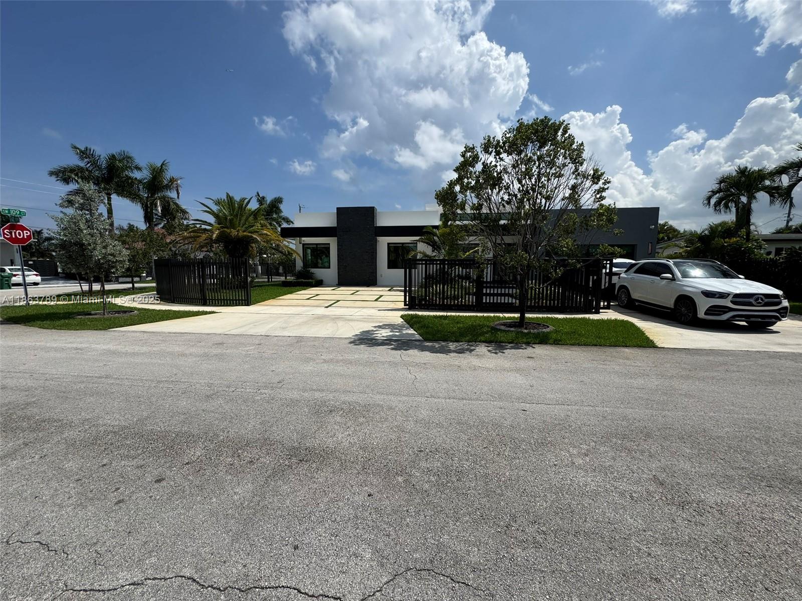 10960 Southwest 42nd Terrace Miami, FL 33165 - Photo 6 of 38 a view of street with parked cars
