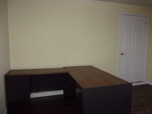 a view of cabinets and wooden floor