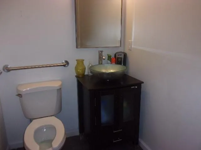 a bathroom with a toilet and a sink