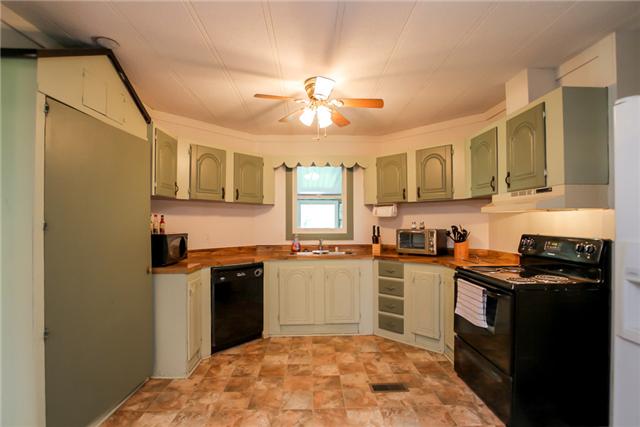6291 Ladd Road Franklin, TN 37067 - Photo 20 of 20 Kitchen view... to the right off the kitchen is the Laundry Room. Master bedroom and walk-in closet in the master and a full bath with separate shower and tub, and two vanity sink. 2 Bedrooms and bath on the other side of house. See Floor Plan.