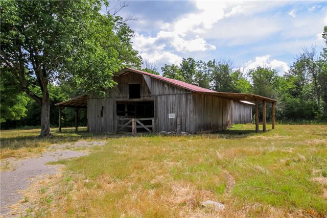 6291 Ladd Road Franklin, TN 37067 - Photo 2 of 20 11 Stall Horse Barn with Tack Room, Hay loft, Front and Rear Barn Doors. There is electricity in the Barn as well.