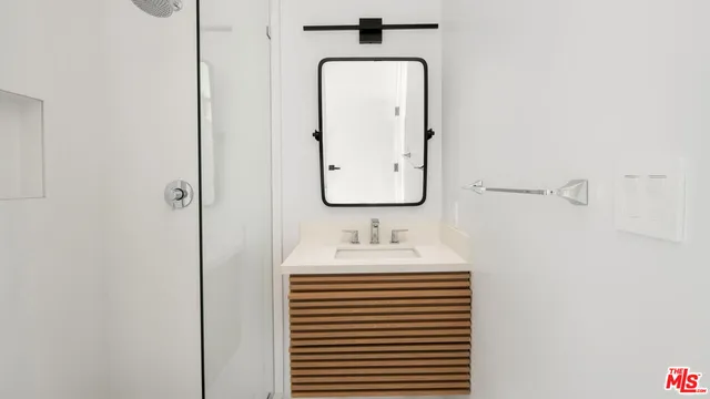 a bathroom with a sink and a mirror