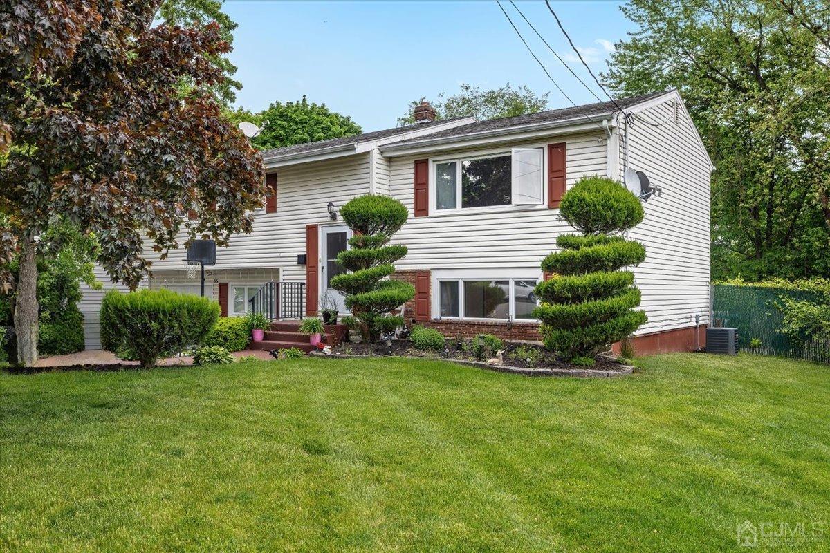 15 Drake Road Somerset, NJ 08873 - Photo 1 of 27 a view of a house with a yard and sitting area