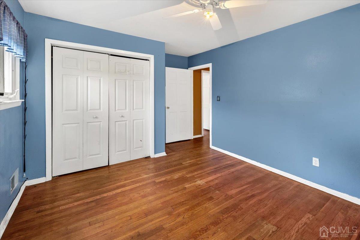 15 Drake Road Somerset, NJ 08873 - Photo 14 of 27 a view of an empty room with wooden floor