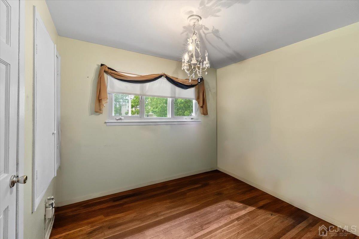 15 Drake Road Somerset, NJ 08873 - Photo 19 of 27 a bathroom with a wooden floor and a window