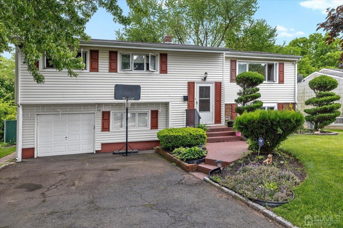 15 Drake Road Somerset, NJ 08873 - Photo 2 of 27 a front view of a house with a yard and garage