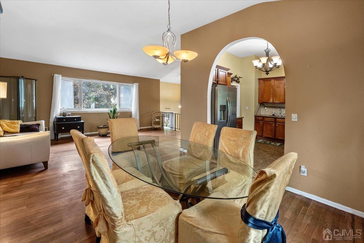 15 Drake Road Somerset, NJ 08873 - Photo 7 of 27 a view of a dining room with furniture and wooden floor