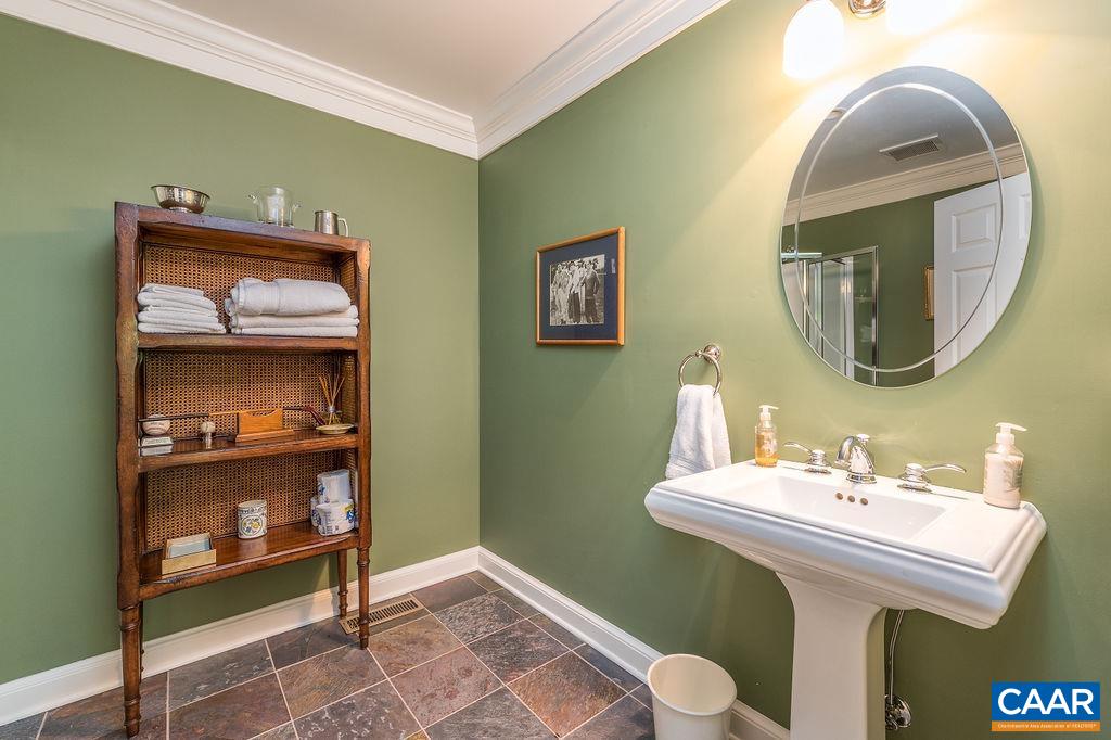 960 Windsor Road Charlottesville, VA 22901 - Photo 33 of 51 a bathroom with a sink and a mirror