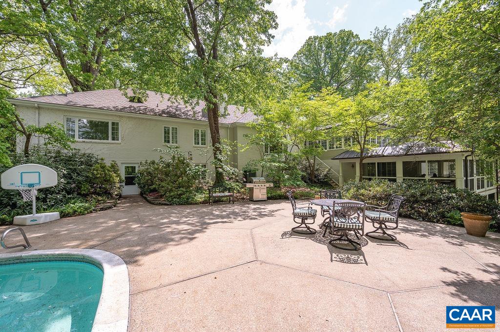 960 Windsor Road Charlottesville, VA 22901 - Photo 42 of 51 a view of a patio with table and chairs with wooden fence and plants