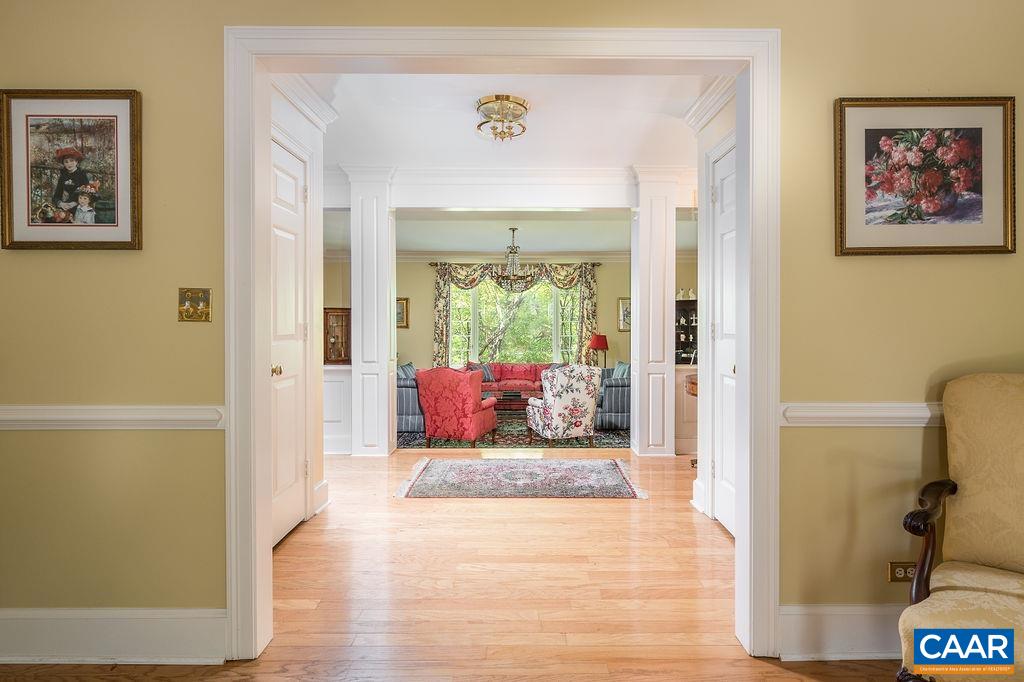 960 Windsor Road Charlottesville, VA 22901 - Photo 9 of 51 a view of a hallway with bathroom and wooden floor