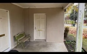 a view of house with backyard