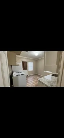 a view of kitchen island with stainless steel appliances